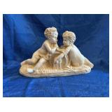 Cherub like figurine