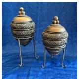 Decorative urns on stands