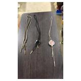 2 STONE BOLOS & 2 SPARE STRINGS