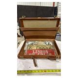 BRIEFCASE FULL OF LICENSE PLATES