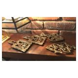 COLL OF BRASS TRIVETS