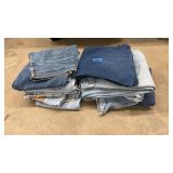 STACK OF ASST JEANS
