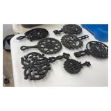 7 CAST IRON TRIVETS
