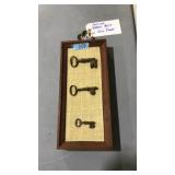ANTQ. BRASS KEYS ON WOOD FRAME
