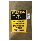 SENSE OF HUMOR TIN SIGN