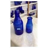 2 COBALT BLUE GLASS MILK JUGS