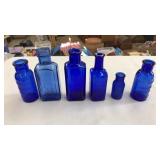 (6) SMALL COBALT BLUE MEDICINE BOTTLES