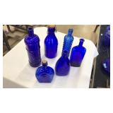 LOT OF COBALT BLUE GLASS BOTTLES