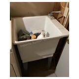 Laundry tub, not connected, and contents