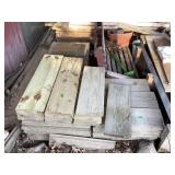 Treated pile of lumber cut offs & porch swing