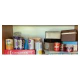 Shelf of vintage metal juice cans, recipe boxes