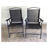 2 black outdoor folding chairs