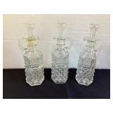Three 8' matching cruet bottles