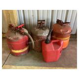 4 gas cans, 2 large are full, 2 gallon is more
