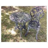 Black cast metal table & chair, table 24x27' tall