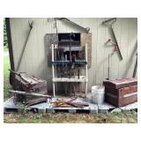 Yard tools, shepherds hook, decorative trunks,