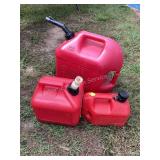 1, 2 & 5 gallon gas cans, some fuel