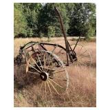 Antique hay rake with steel wheels