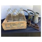 Crate, bottles, oil cans & old ice skates