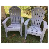2 grey plastic Adirondack chairs