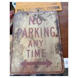 Two metal signs no parking anytime warning