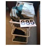 BAsket rack with bedding, towels and curtains