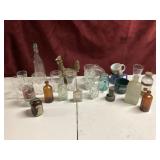 Set of glass cups, vintage bottles.