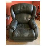 Dark green rocking and recliner chair.