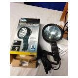 Corded spotlight, battery charger, camera stand
