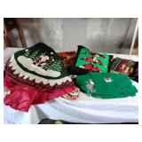 Big bin full of Christmas skirts, towels,