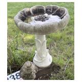 Small birdbath concrete has some cracks and of