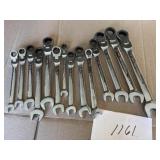 Assorted adjustable wrenches, both metric and SAE