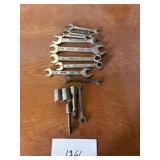 Three snap on sockets, one blue point wrench ,