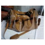 Large brown bag and American Tourist leather bag