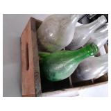Vintage bottles in wooden Coca Cola crate