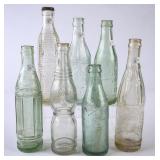 7 Embossed Glass Bottles
