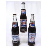 3 Pepsi Commemorative Filled Clear Glass Bottles
