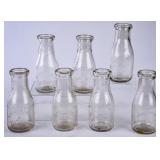 7 NC Embossed Round Clear Pint Milk Bottles