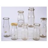 7 NC Embossed Round Half Pint Milk Bottles