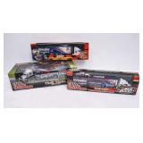 3 NIB Model Transporters w/ Stock Cars
