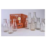 9 NC Embossed Round Quart Milk Bottles