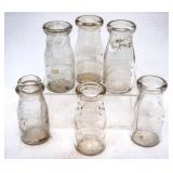 6 Embossed NC 1/2pt Milk Bottles