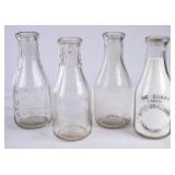 4 NC Embossed Round Quart Milk Bottles