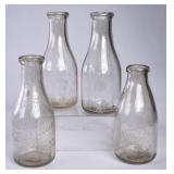 4 TN Embossed Round Quart Milk Bottles