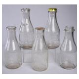 5 SC Embossed Round Quart Milk Bottles
