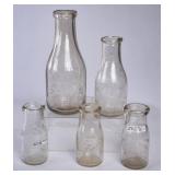 5 SC Embossed Round Milk Bottles