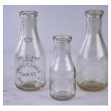 3 Transylvania Dairies Embossed Round Milk Bottles