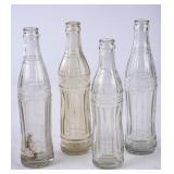 4 Embossed Clear Glass Soda Bottles