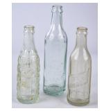 3 Embossed Straight Side Glass Soda Bottles