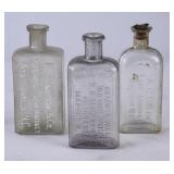 3 NC Embossed Clear Glass Liquor Bottles